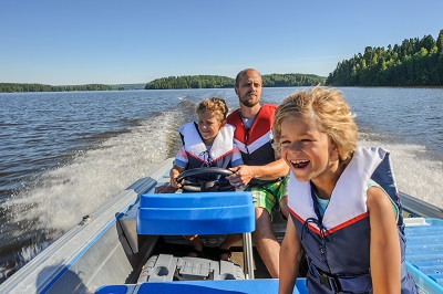 image of family on boat