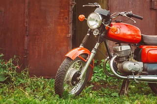 Motorcycle outside barn