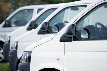 commercial vans parked in a line